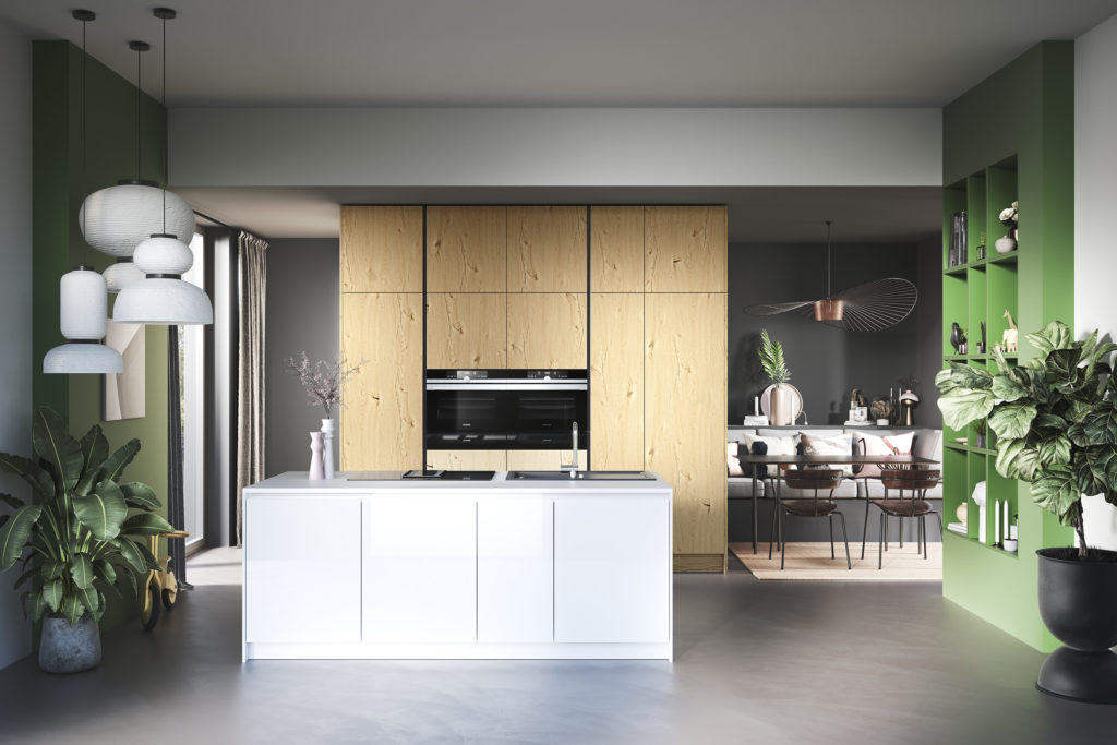 Cocina moderna en tonos madera, blanco y verde intenso.