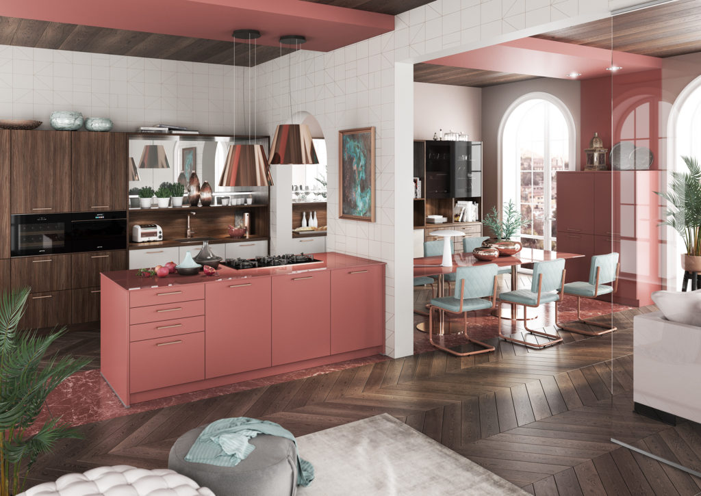 Cocina de estilo vintage con acabados en rosa y madera oscura. Cocina con tirador corto y mesa de comedor.